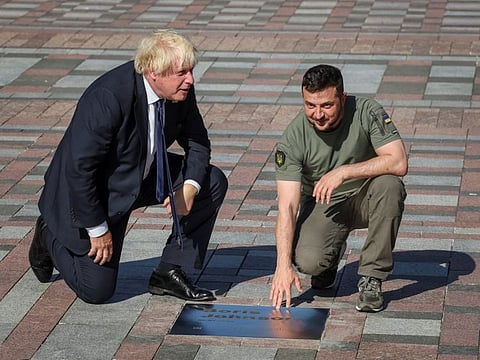 Zelensky and Johnson unveil a plaque with Johnson's name on the Alley of Bravery after a joint news briefing in Kyiv  on August 24, 2022.  