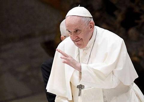 Pope Francis waves to pilgims during the weekly general audience at Paul-VI hall in The Vatican, on August 24, 2022.  