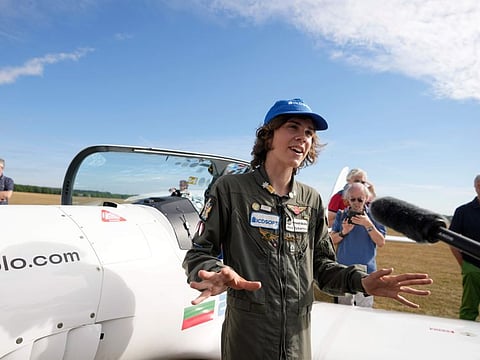 Seventeen year old Anglo-Belgian pilot, Mack Rutherford, speaks with the media after landing at the Buzet airfield in Pont-A-Celles, Belgium, Tuesday, Aug. 23, 2022. Rutherford landed in Belgium before flying on to Slovakia and Sofia, Bulgaria, for the final leg of his Guinness World Record attempt to be the youngest person to the fly around the world solo in a small plane.  