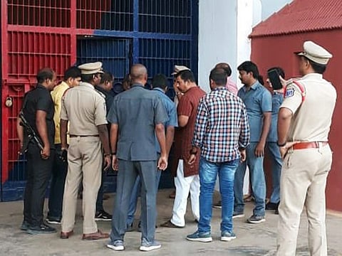  T Raja Singh (in red and white) brought to Cherlapalli Central Jail after being arrested by Telangana Police in Hyderabad on Thursday. 