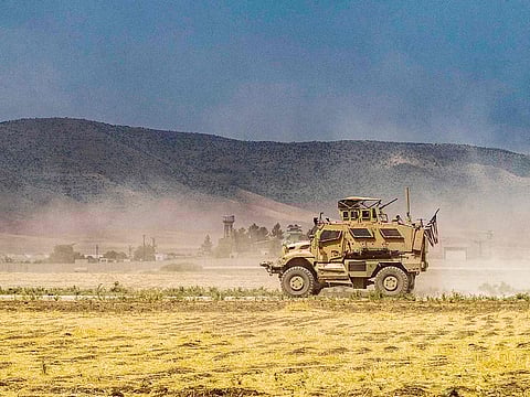 In this file photo a US Oshkosh M-ATV Mine Resistant Ambush Protected (MRAP) military vehicle drives during a patrol near the Syrian-Turkish border in one of the villages that was subject to bombardment the previous week in the countryside east of Qamishli in Syria’s northeastern Hasakah province on August 21, 2022.