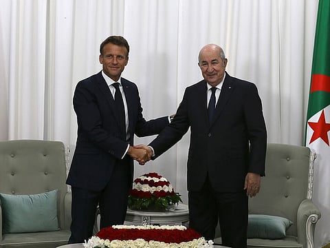 French President Emmanuel Macron, left, shakes hands with Algerian President Abdelmajid Tebboune before their talks, Thursday, Aug. 25, 2022 in Algiers.