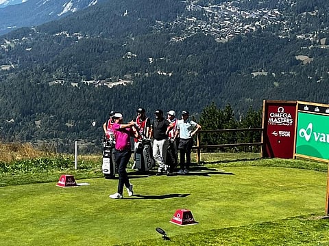 Dubai-based Adrian Meronk teeing off at Crans-sur-Sierre with the stunning mountain views all around.