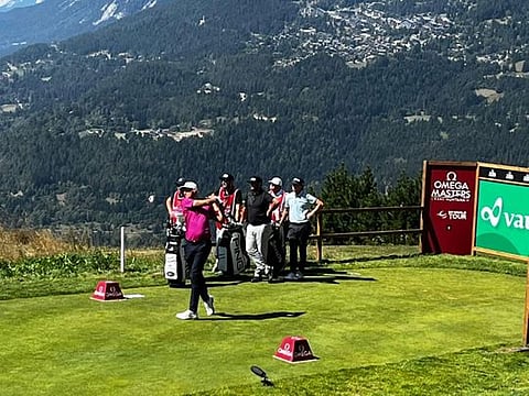 Dubai-based Adrian Meronk teeing off at Crans-sur-Sierre with the stunning mountain views all around.