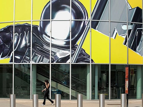 A woman walks by an advertisement for the 2022 MTV Video Music Awards at the Prudential Center in Newark, New Jersey, U.S., August 26, 2022. 