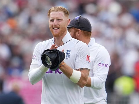 England's captain Ben Stokes applaud his teammates as he leaves the field after their win on the third day of the second Test match against South Africa at Old Trafford in Manchester, England.