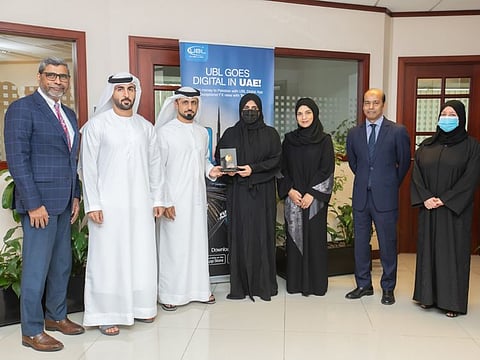 Huda Hussein Al Marri (centre) being honoured