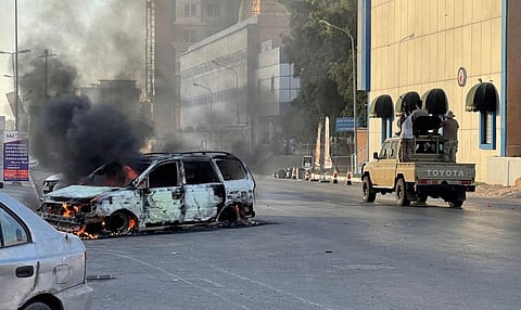 Fighters loyal to the Government of National Unity are pictured in a street in the Libyan capital Tripoli on August 27, 2022, following clashes between rival Libyan groups. 
