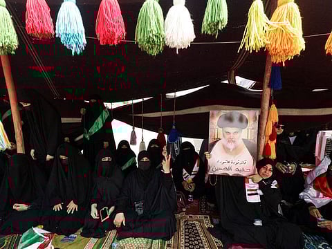 Supporters of Iraqi populist leader Moqtada Al Sadr gather outside the parliament near the Green Zone, in Baghdad.