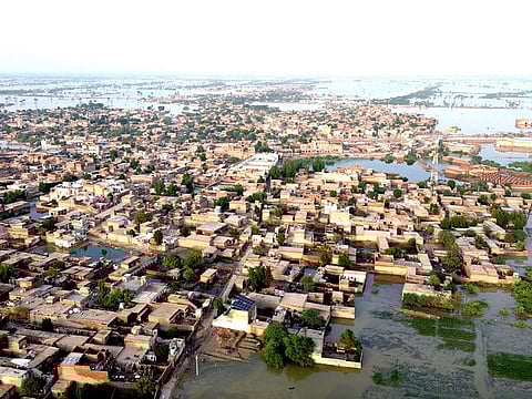 This aerial view shows a flooded residential area after heavy monsoon rains in Balochistan province on August 29, 2022.