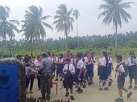 School students and staff gather in an open area after a magnitude 6.4 earthquake struck near Mentawai Islands on August 29, 2022 in this screen grab obtained from a social media video.