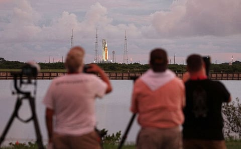 Press photographers set up to over the Artemis I Space Launch System rocket mission at the Kennedy Space Center in Florida on August 29, 2022.  