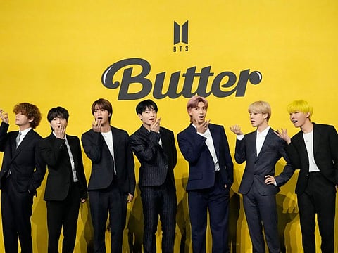 Members of South Korean K-pop band BTS, V, SUGA, JIN, Jung Kook, RM, Jimin, and j-hope from left to right, pose for photographers ahead of a press conference.