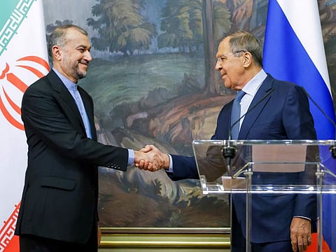 Russian Foreign Minister Sergey Lavrov, right, and Iranian Foreign Minister Hossein Amir-Abdollahian shake hands after a joint news conference following their talks in Moscow, on Aug. 31, 2022.  
