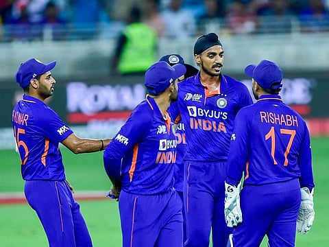 Arshdeep Singh of India celebrates after taking the wicket of Yasim Murtaza of Hong Kong during the Group 'A' match in DP World Asia Cup 2022 at the Dubai International Stadium.