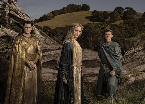 This image released by Amazon Studios shows Benjamin Walker, from left, Morfydd Clark and Robert Aramayo from "The Lord of the Rings: The Rings of Power."
