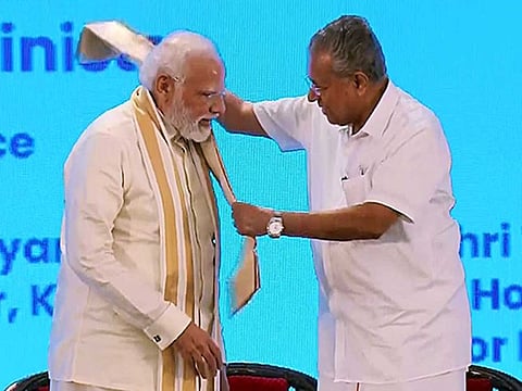 Kerala CM Pinarayi Vijayan felicitates Prime Minister Narendra Modi at an event marking the foundation stone laying of Phase-2 corridor of Kochi Metro Rail and other projects, in Kochi on Thursday, September 1, 2022. 