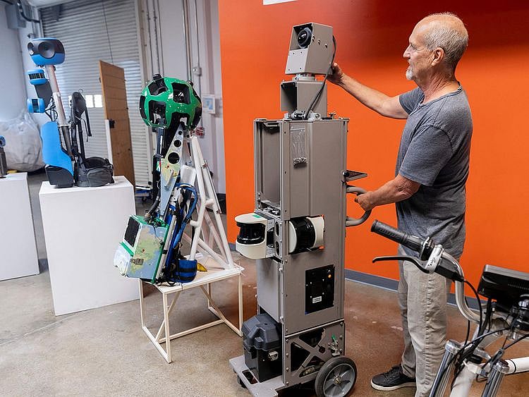 Steven Silverman, Senior Technical Program Manager and Manager of Imagery Solutions for Google, shows off past Google Street View Camera devices at the Google Street View Garage in Mountain View, California.