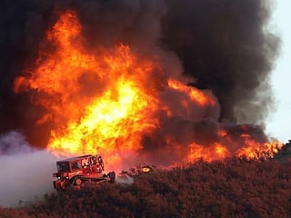 Pictures: Thousands flee, several hurt as wildfire scorches California