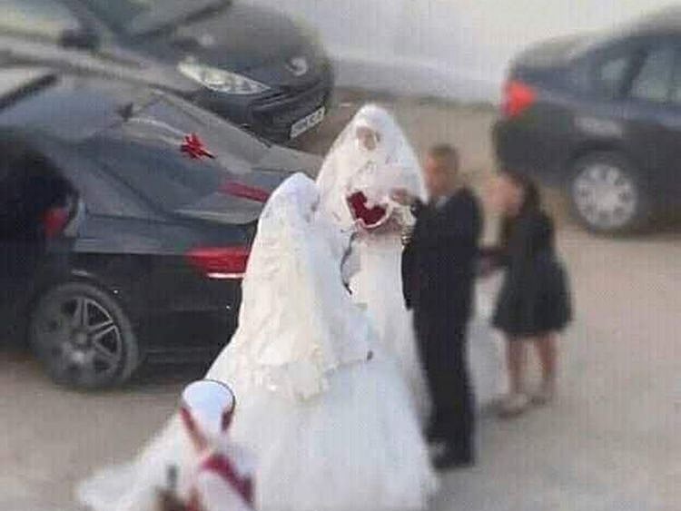 Rashid with the two women after the wedding.