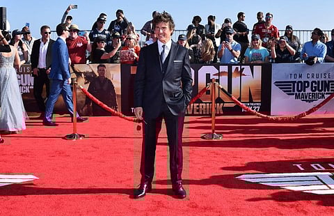Tom Cruise arrives at the world premiere of "Top Gun: Maverick" on Wednesday, May 4, 2022, at the USS Midway in San Diego.