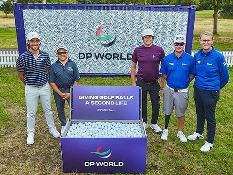 Tommy Fleetwood (left) with EDGA players and officials at this week's BMW PGA Championship at Wentworth with a container of unwanted golf balls from tournaments across the DP World Tour this season.