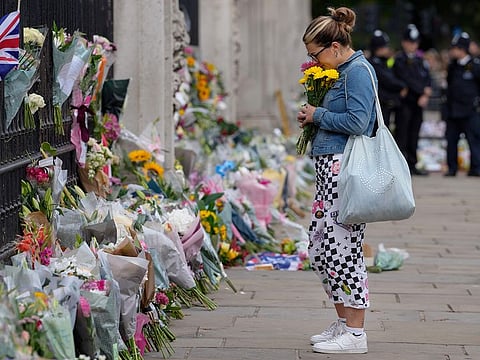 Flowers at the gate of Buckingham Palace in London, Friday, Sept. 9, 2022. Queen Elizabeth II, 