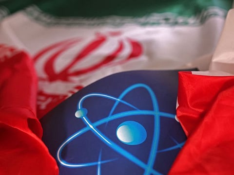 Atomic symbol and Iranian flag are seen in this illustration taken on September 8, 2022.  The IAEA’s Board of Governors meet on Monday, three months after already adopting a resolution urging Iran to give credible answers to the watchdog