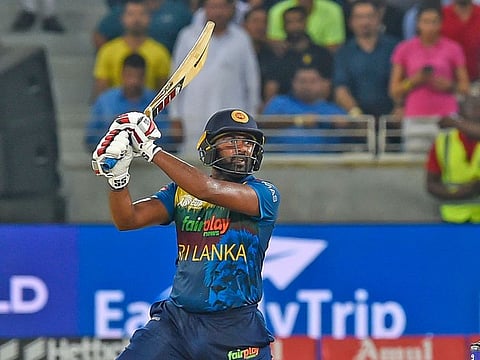 Sri Lankan batsman Bhanuka Rajapaksa hammers a six against Pakistan in the DP World Asia Cup final at the Dubai International Stadium on September 11, 2022. 