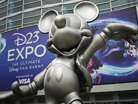 A statue of Mickey Mouse welcomes attendees to the Walt Disney D23 Expo in Anaheim, California.