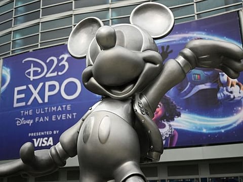 A statue of Mickey Mouse welcomes attendees to the Walt Disney D23 Expo in Anaheim, California.