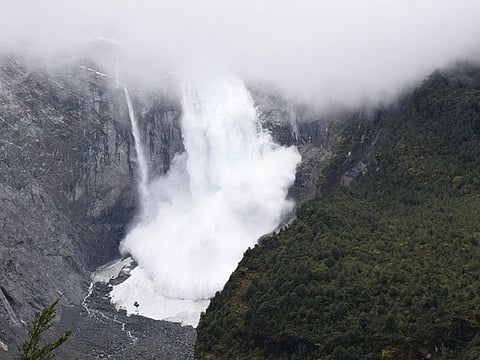 A glacier is pictured calving into the river, in Queulat National Park, in Aysen, Chile. 
