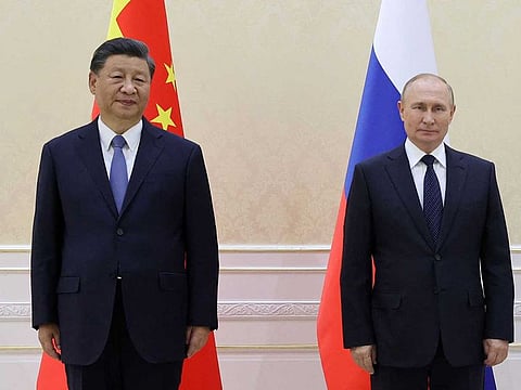 China's President Xi Jinping and Russian President Vladimir Putin on the sidelines of the Shanghai Cooperation Organisation (SCO) leaders' summit in Samarkand on September 15, 2022.  