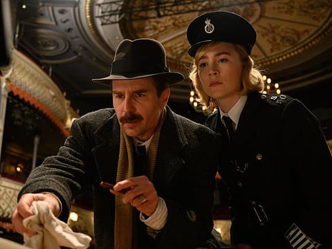 This image released by Searchlight Pictures shows Sam Rockwell and Saoirse Ronan in a scene from "See How They Run."