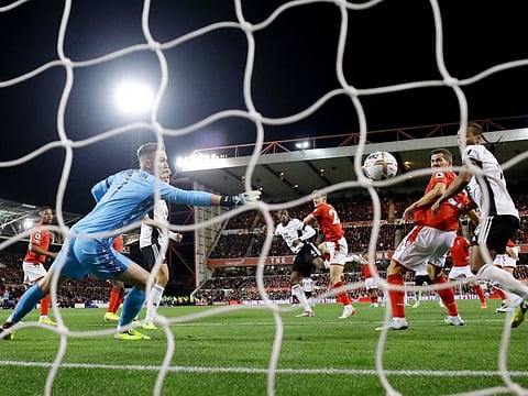 Fulham's Tosin Adarabioyo scores against Nottingham Forest's Dean Henderson at The City Ground, Nottingham, Britain.