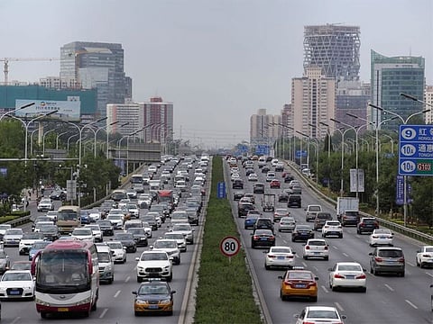 File picture: Cars drive on the road during the morning rush hour in Beijing, China.