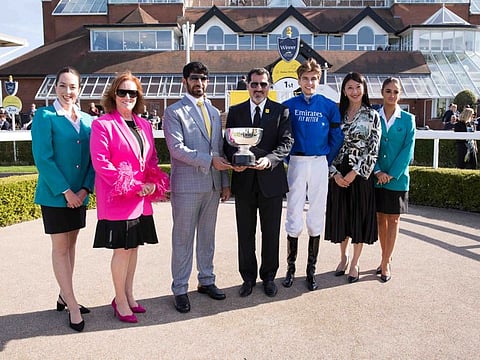Winning-trainer Saeed Bin Suroor and jockey Louis Steward, Sinead El Sibai and Anna Khan with the Dubai Duty Free Handicap trophy following Marching Army's victory.