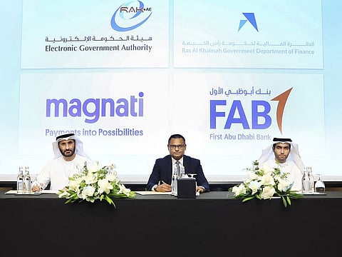 (Left to right) Yousef Albolooshi, Ramana Kumar Ahmed bin Saeed Al Sayyah after signing the partnership agreement.