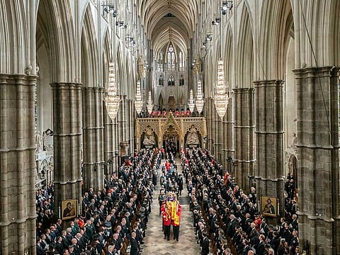 King Charles III, Camilla, the Queen Consort and members of the Royal family follow behind the coffin of Queen Elizabeth II, draped in the Royal Standard with the Imperial State Crown and the Sovereign's orb and sceptre,  as it is carried out of Westminster Abbey after her State Funeral, in London, Monday Sept. 19, 2022. 