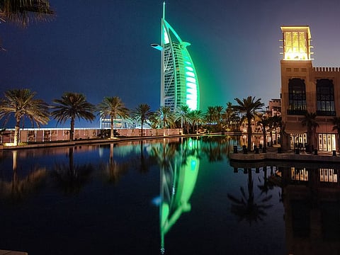 Burj Al Arab hotel in Dubai lit up in the green colour of the Saudi flag