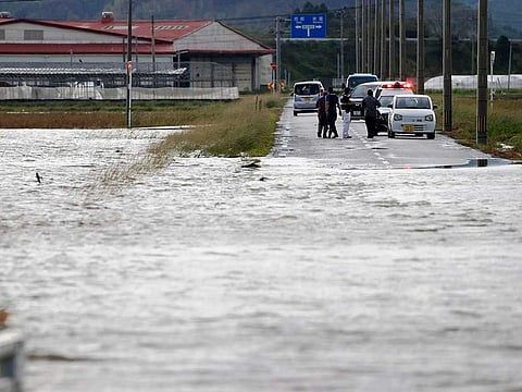 A road is submerged under water in Saito, Miyazaki Prefecture, Japan Monday, Sept. 19, 2022 after typhoon Nanmadol slammed southwestern Japan. 