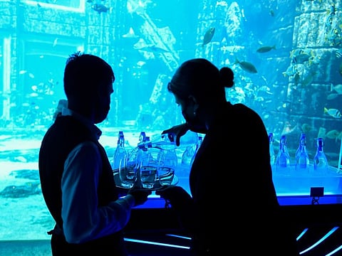 Staff members pouring water from glass bottles at Atlantis, The Palm after the opening of customised  on-site water purification and bottling plant to stop the use of sigle use plastic bottles. Photo; Virendra Saklani/Gulf News