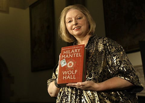 Winner of the 2009 Booker Prize for fiction Hilary Mantel with their book ' Wolf Hall ' poses for photographers following the announcement in central London, on Oct. 6, 2009.