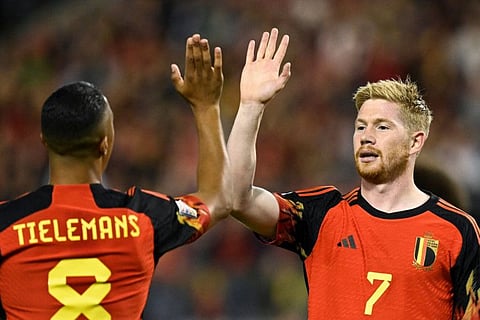Belgium's midfielder Kevin De Bruyne (right) celebrates with teammates after opening the scoring during the Nations League League A Group 4 match against Wales at The King Baudouin Stadium in Brussels on Thursday.