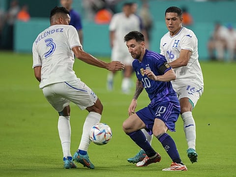 Lionel Messi (centre) of Argentina in action against Honduras.