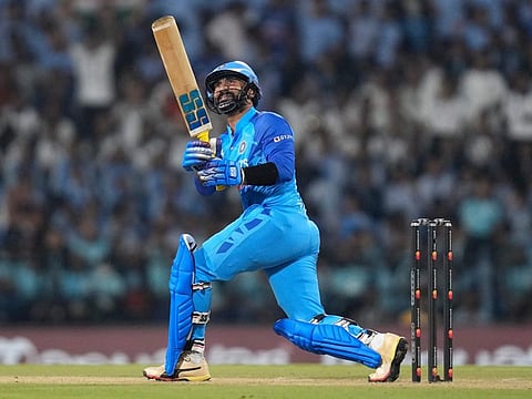 India's Dinesh Karthik hits a six during the second T20 match against Australia, in Nagpur, India.