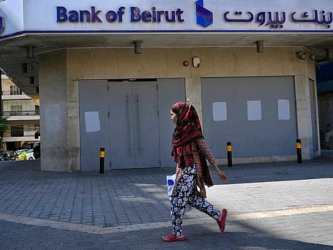 The facade of a closed Bank of Beirut branch is covered with metal sheets to prevent vandalism or attacks, in Beirut, Lebanon, Thursday, Sept. 22, 2022.