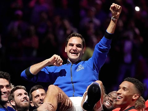 Novak Djokovic and other members of Team Europe and Team World at the Laver Cup lift Roger Federer at the end of his last match after announcing his retirement at the O2 Arena in London on September 23, 2022. 