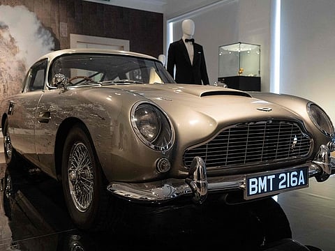 An Aston Martin DB5 stunt car from the film "No Time to Die" is displayed during a photocall ahead of the "Sixty Years of James Bond" auction.