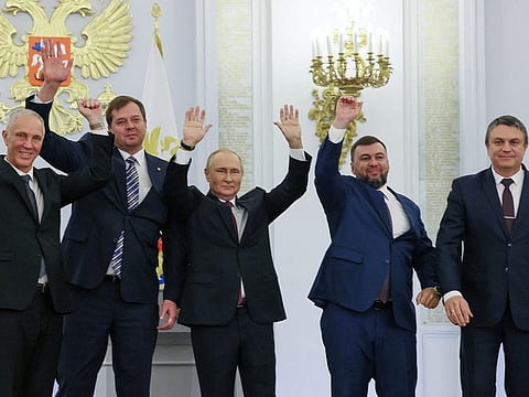 Russian President Vladimir Putin and Denis Pushilin, Leonid Pasechnik, Vladimir Saldo, Yevgeny Balitsky, who are the Russian-installed leaders in Ukraine's Donetsk, Luhansk, Kherson and Zaporizhzhia regions, attend a ceremony to declare the annexation of the Russian-controlled territories, in the Georgievsky Hall of the Great Kremlin Palace in Moscow, on September 30, 2022. 